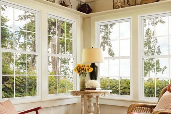 Double-hung window with tilt-in sashes