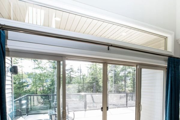 Decorative transom window above entry door